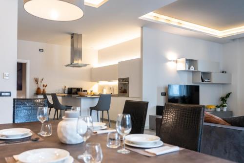 a dining room with a table and chairs at San Carlo Premium - Torino Centro in Turin