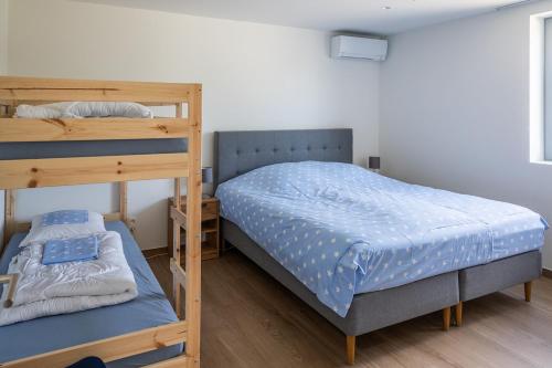 Postel nebo postele na pokoji v ubytování Den Eenink