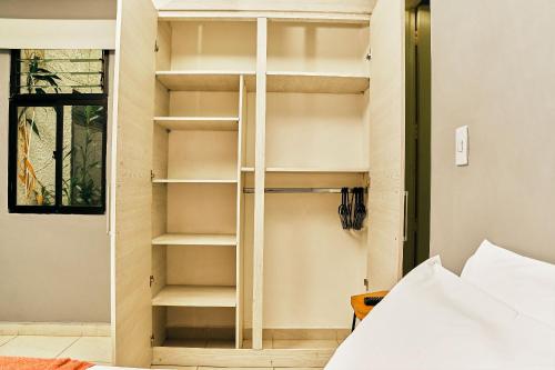 Ένα ή περισσότερα κρεβάτια σε δωμάτιο στο Apartamentos y Loft Laureles