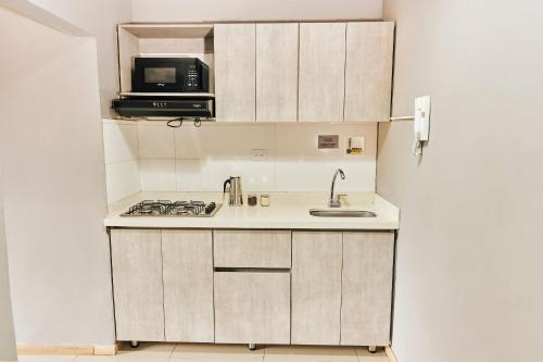Η κουζίνα ή μικρή κουζίνα στο Apartamentos y Loft Laureles