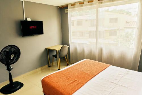 Μια τηλεόραση ή/και κέντρο ψυχαγωγίας στο Apartamentos y Loft Laureles