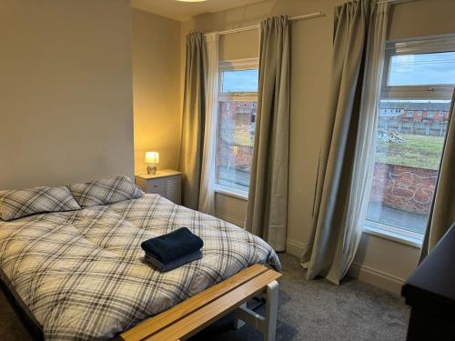 Ένα ή περισσότερα κρεβάτια σε δωμάτιο στο Central and Stylish Belfast City Home
