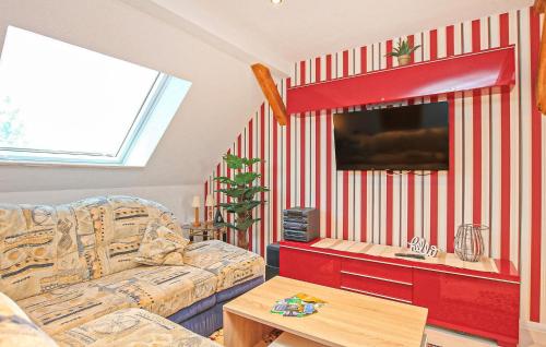 a living room with a couch and a tv at Ferienwohnung Dabel in Dabel