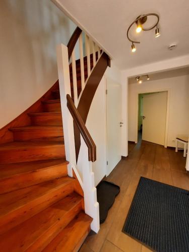 a staircase in a house with wooden floors at Ferienhaus in der Schleife 2 in Rendsburg in Rendsburg