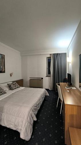 Postel nebo postele na pokoji v ubytování HOTEL QUADRIFOGLIO