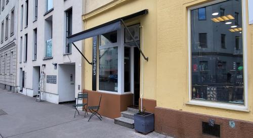 a store front with a glass window on a street at urbanhood16 in Vienna