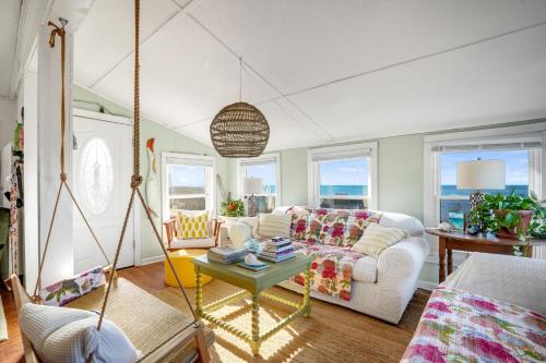 a living room with a couch and a swing at Beach Bettie's in Cape Charles