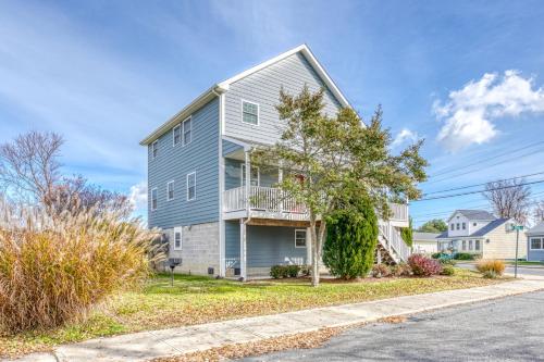 a gray house with a balcony on a street at Beach Haven - Modern Home; Close to town! in Chincoteague