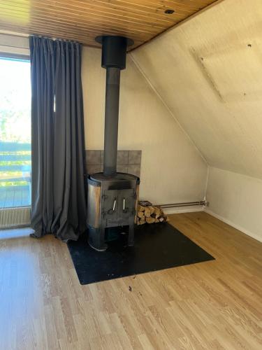 a woodburning stove in a room in a house at Hyggelige 200kvm villa udenfor køge tæt på strand in Køge