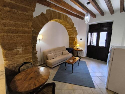 a living room with a couch and a table at I Tetti di Girgenti in Agrigento