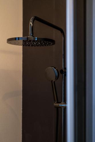 a close up of a door with a shower head at TORO by Buenavilla in Puerto Calero