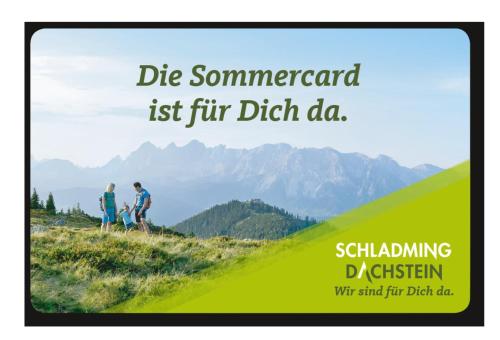 a flyer of two people walking on a hill with mountains in the background at Huberhof 9 by Alpenidyll Apartments in Rohrmoos