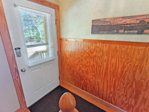 an empty room with a door and a window at Channel Watch - Waterfront home with private Pier! in Deep Hole