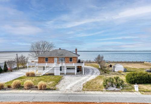 a house on the side of a road at Cozy Nest - Waterview, Pet Friendly, Screened Porch in Deep Hole