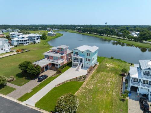 an aerial view of homes and a river at Day Dream Believer - New Construction, Upscale Resort, Many Amenities! in Cape Charles