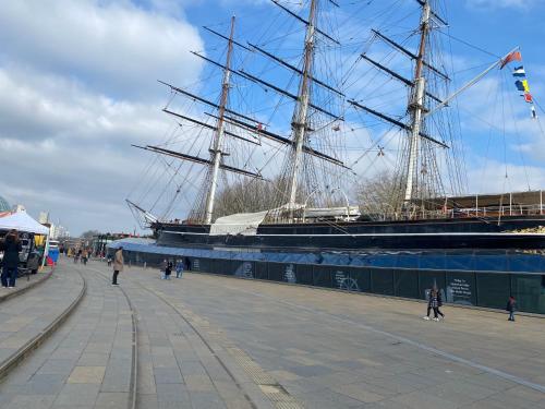 a large ship is docked next to a pier at River view spacious apartment in London