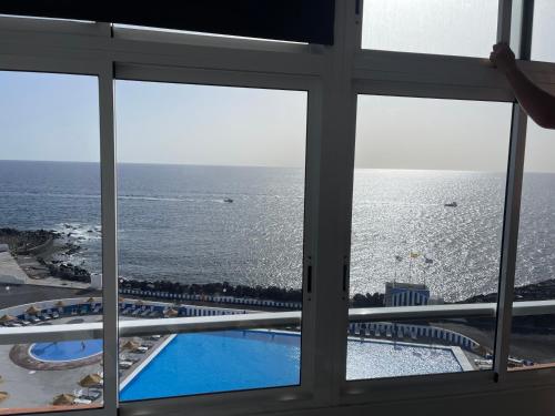 a view of the ocean from a hotel window at Mirador La Galera, junto a la playa in Candelaria