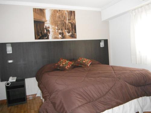Ένα ή περισσότερα κρεβάτια σε δωμάτιο στο Hotel Zurich