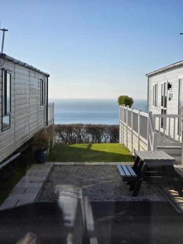 a view of the ocean from the balcony of a house at Holiday home in Durdle door with stunning Sea view in West Lulworth