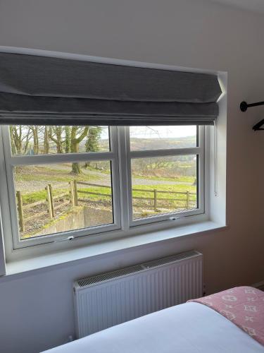 Katil atau katil-katil dalam bilik di Faerdre Manor Large Holiday Home
