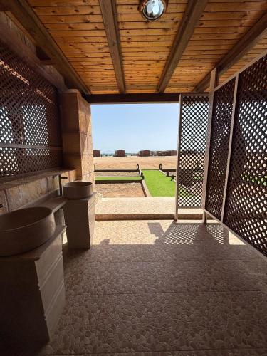 a view from the inside of a building with a gate at Mangrove Camp in Sharm El Sheikh