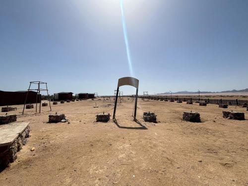 an empty field with a fence in the desert at Mangrove Camp in Sharm El Sheikh