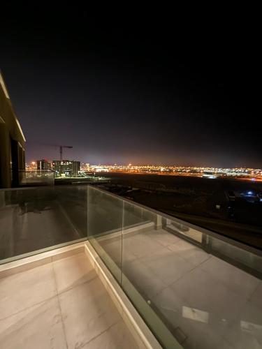 a view from the roof of a building at night at Monthly Only, 1BR Aprt,Beach Access,Garden View in Amwaj Island