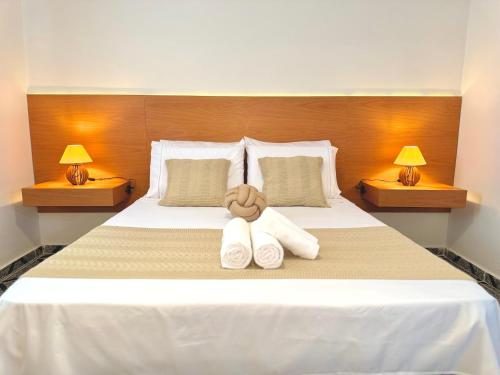 a bedroom with a bed with a teddy bear on it at AirComfort Stay - 15min Aeroporto Internacional de Guarulhos in Guarulhos