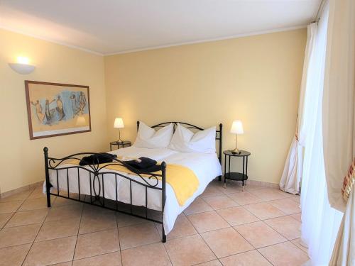 Una cama o camas en una habitación de Rosa Blu