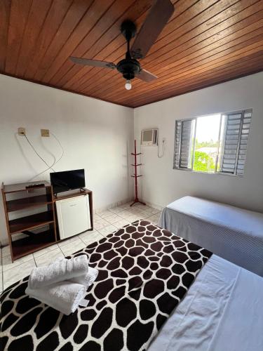 Ein Bett oder Betten in einem Zimmer der Unterkunft Pousada Orla do Sol