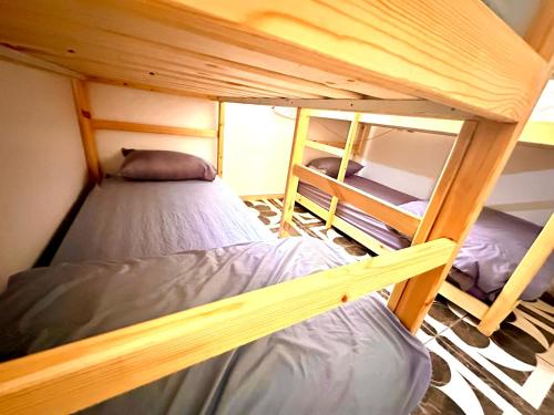 a couple of bunk beds in a room at Imsouane Surf Slab Hostel in Imsouane