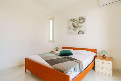 Oasi Kite - Stagnone Apartmentsにあるベッド
