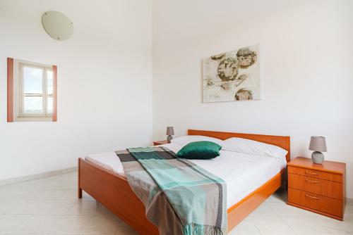 Oasi Kite - Stagnone Apartmentsにあるベッド
