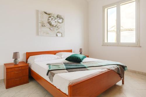 Oasi Kite - Stagnone Apartmentsにあるベッド