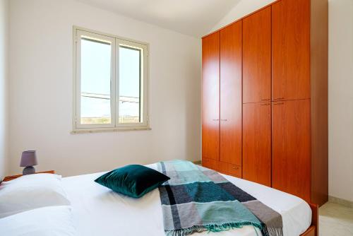 Oasi Kite - Stagnone Apartmentsにあるベッド