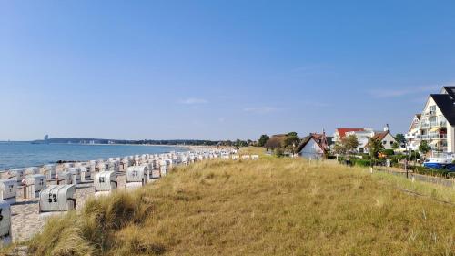 a row of gravestones on a hill next to the water at Ferienhaus Boje14a in Haffkrug