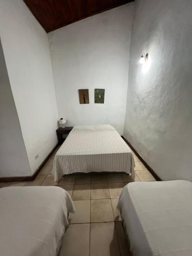 Postel nebo postele na pokoji v ubytování Posada el Yacaré