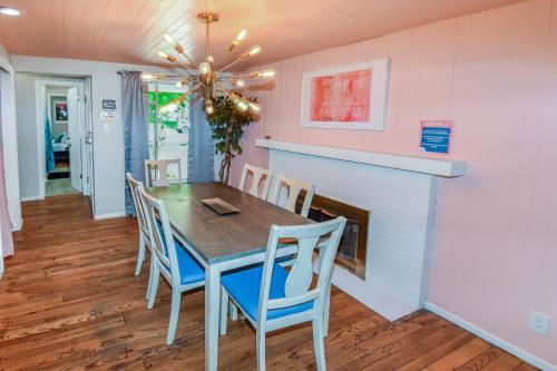 a dining room with a table and chairs and a fireplace at Super Cute Five Bedroom Home in Denver Perfect For Girls Trips in Denver