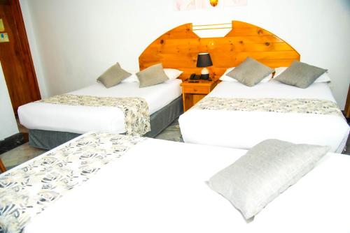 Postel nebo postele na pokoji v ubytování Hotel la Giralda