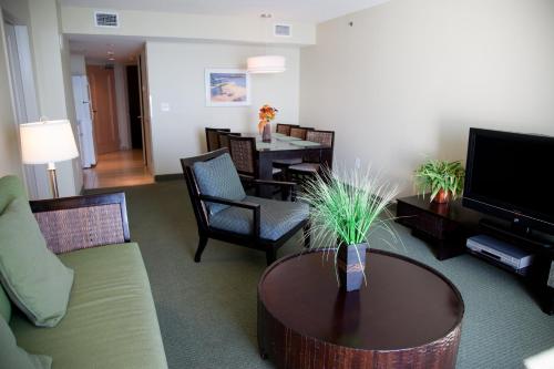 a living room with a couch and a table at Seaside Resort in Myrtle Beach