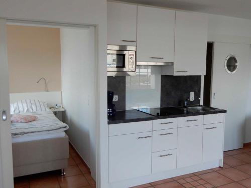 Kuchyň nebo kuchyňský kout v ubytování Appartement Fördeblick am Strand von Wassersleben App 631