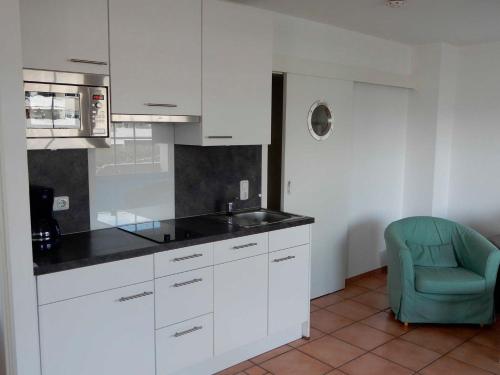 Kuchyň nebo kuchyňský kout v ubytování Appartement Fördeblick am Strand von Wassersleben App 631