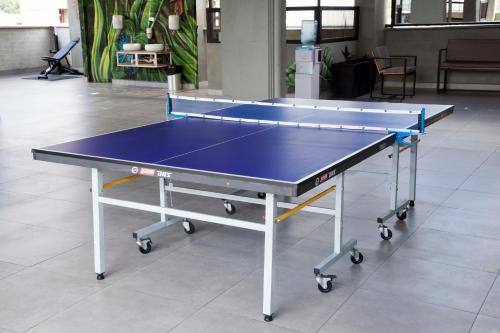 a ping pong table in a room with at Edificio Helena in Medellín