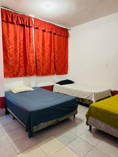 Postel nebo postele na pokoji v ubytování Gually Hostel