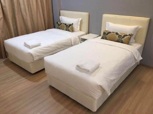 Ένα ή περισσότερα κρεβάτια σε δωμάτιο στο Alami Garden Hotel