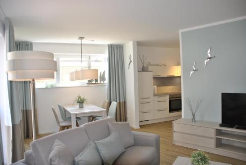 Kuchyň nebo kuchyňský kout v ubytování Ferienwohnung "Silbermöwe II", Hafenspitze Quartier
