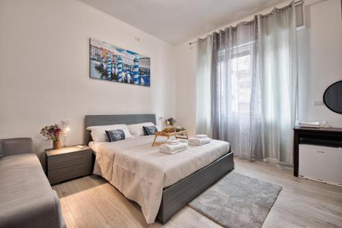 Postel nebo postele na pokoji v ubytování La Venezia Station Residence Mestre