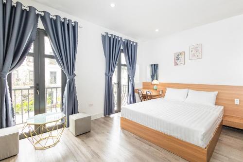 Postel nebo postele na pokoji v ubytování Fame Apartment