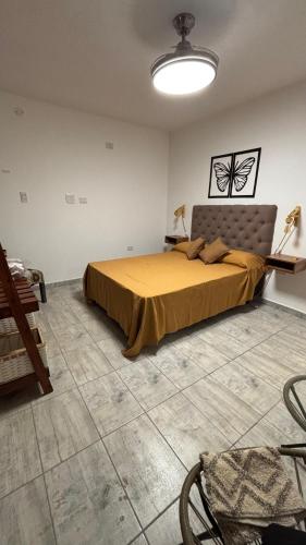 a bedroom with a large bed in a room at Brisas Rumipal dúplex premium Villa Rumipal in Villa Rumipal
