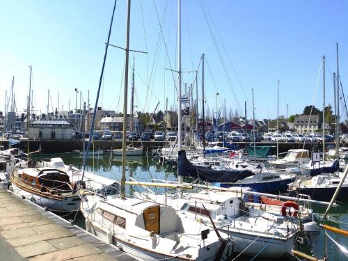 a bunch of boats are docked in a marina at Stone House near Pink Granite Coast Beaches in Plougrescant